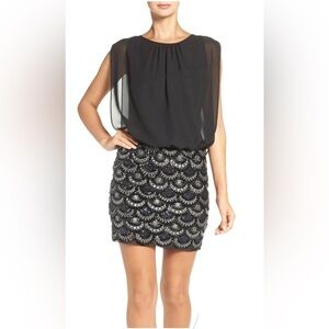 Aidan Mattox blouson dress with a gold and silver sequined skirt.